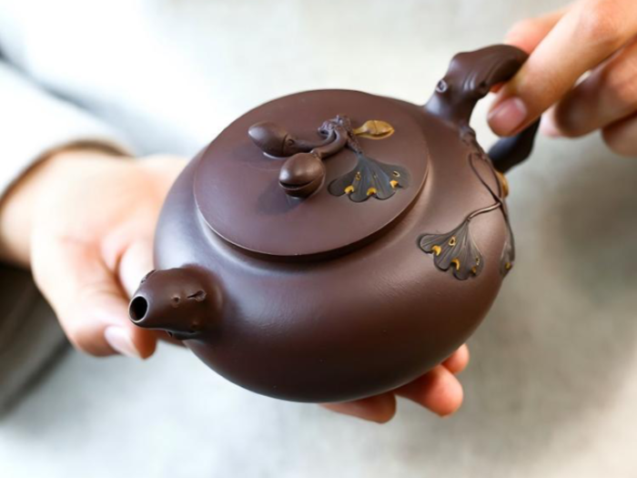 chinese teapot and cups with handcrafted details 2