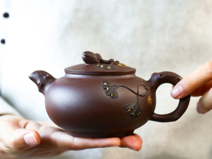 chinese teapot and cups with handcrafted details 3