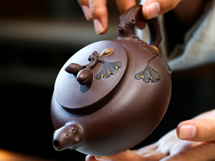 chinese teapot and cups with handcrafted details 4